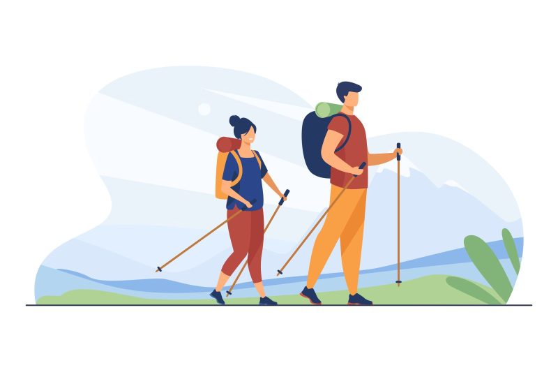 Couple with backpacks walking outdoors